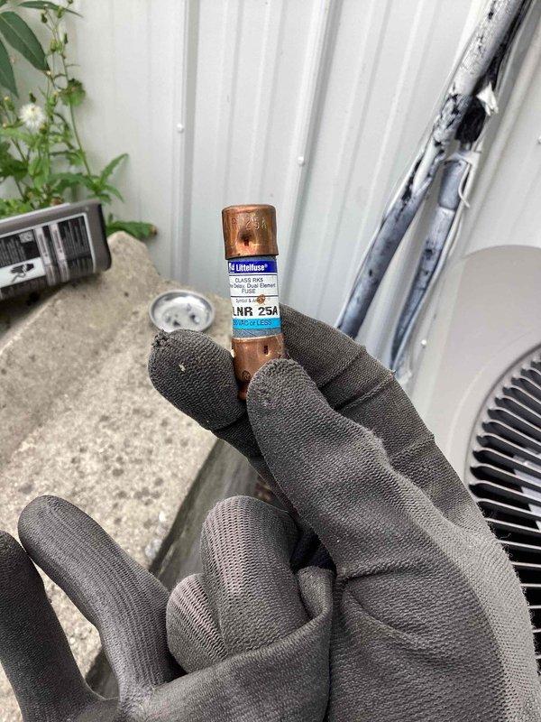 Responded to service call for non-operational commercial air conditioning unit. Upon arrival, performed diagnostic testing and discovered a failed 25-amp Class RK5 fuse in the electrical disconnect. Replaced the blown Littelfuse LNR 25A fuse and verified proper amperage rating for the equipment. Tested system operation and confirmed supply air temperature of 77°F at the ductwork, with unit now functioning properly and cooling effectively.