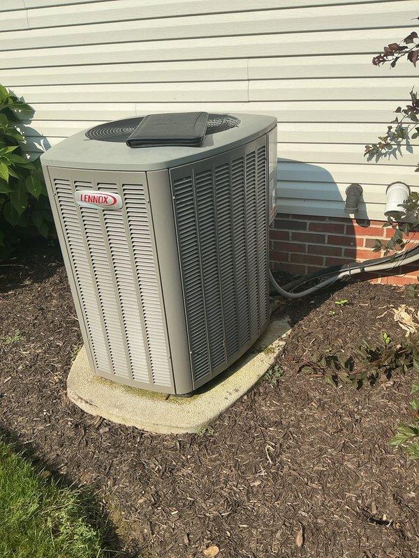 Completed full HVAC system replacement including installation of new Lennox furnace and matching outdoor condensing unit. Removed existing equipment and installed new high-efficiency furnace in basement utility area with proper venting using white PVC piping for intake and exhaust. Positioned new Lennox condensing unit on existing concrete pad against exterior wall, connected refrigerant lines, and established electrical connections. Verified all components are operational, tested system performance, and ensured proper airflow through ductwork connections.