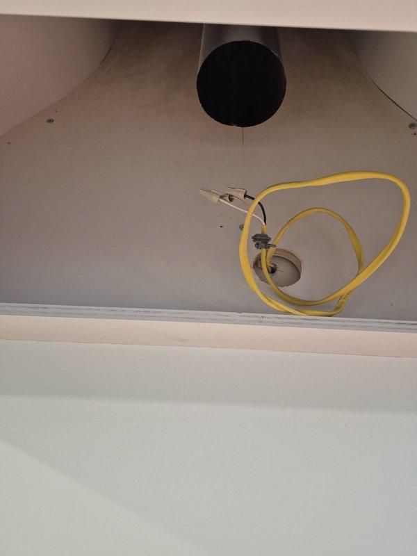 Completed installation of HVAC registers and hood vent system in new construction property. Finalized furnace condensate drain line connections and verified proper drainage. Installed thermostat wiring and mounted digital control unit on interior wall for system operation.