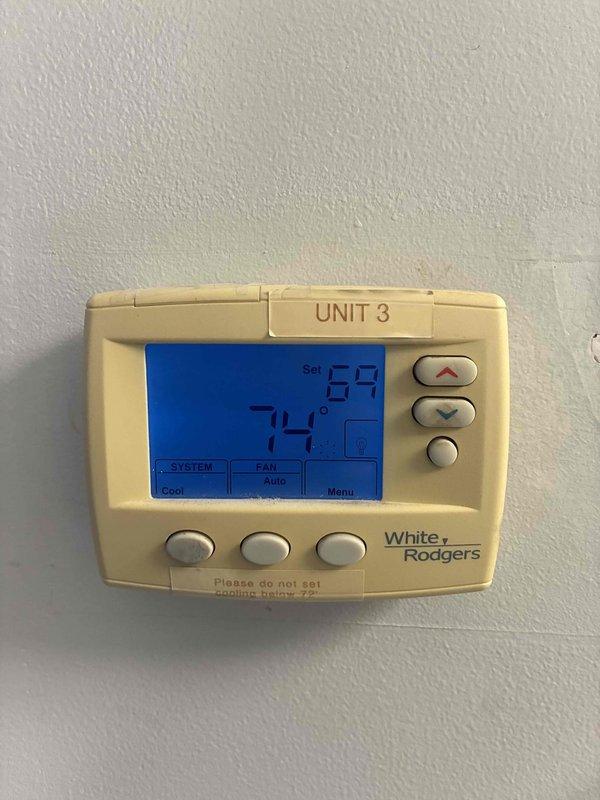 Returned to site to re-evaluate Unit 3 air conditioning system following previous day's service work. Verified thermostat operation and confirmed system is cycling properly in cooling mode with fan set to auto. Temperature differential between current reading and setpoint functioning as expected, with unit maintaining proper call for cooling. Documented thermostat settings and system status showing normal operation.