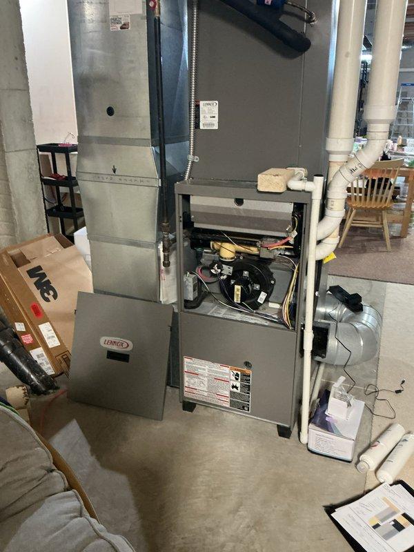 Completed full HVAC system replacement in residential basement, installing new Lennox furnace and air conditioning equipment. Configured ductwork connections with flexible metallic transitions, installed supply plenum above furnace unit, and ensured proper PVC condensate drainage routing. All components tested and operational upon completion.