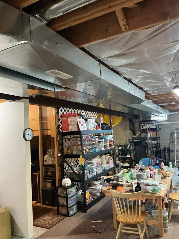 Completed full HVAC system replacement in residential basement, installing new Lennox furnace and air conditioning equipment. Configured ductwork connections with flexible metallic transitions, installed supply plenum above furnace unit, and ensured proper PVC condensate drainage routing. All components tested and operational upon completion.