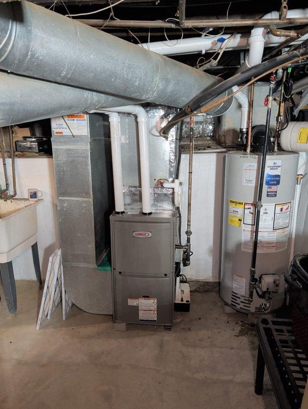 Completed full furnace and hot water heater replacement in residential basement as part of weatherization assistance program. Installed new Lennox furnace with proper PVC venting system and connected to existing ductwork infrastructure. Replaced existing water heater with new unit, establishing all necessary plumbing connections including copper and PVC piping. Verified proper operation of both systems, confirmed adequate clearances, and ensured all equipment met current code requirements.