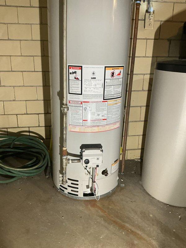 Responded to service call for 10-year-old tanked water heater producing popping noises. Upon inspection, assessed unit for sediment buildup, which is the typical cause of popping sounds in aging water heaters. Evaluated the condition of the water heater, copper supply lines, and venting system. Also assessed laundry room utility sink for potential faucet installation, noting existing plumbing configuration and determining feasibility of adding requested fixture. Documented equipment condition and provided recommendations for drain and flush service to eliminate sediment accumulation and restore quiet operation.