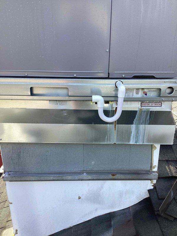 Responded to no cooling complaint on commercial rooftop HVAC unit. Upon arrival, performed diagnostic testing and measured supply air temperature at 92.5°F, confirming inadequate cooling output. Inspected outdoor condensing unit, noting proper drainage trap installation and overall equipment condition, and documented findings for further evaluation of refrigerant system and compressor operation.