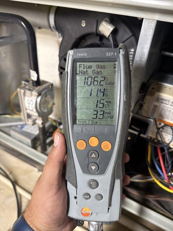 Completed comprehensive fall heating tune-up and system inspection on natural gas furnace. Performed combustion analysis using Testo 327-1 analyzer, confirming proper operation with flue gas temperature at 106°F, excess air at 52.9%, and satisfactory airflow readings of 16-25 CFM. Verified all safety controls, electrical connections, and gas valve operation. System operating within manufacturer specifications with no issues identified.