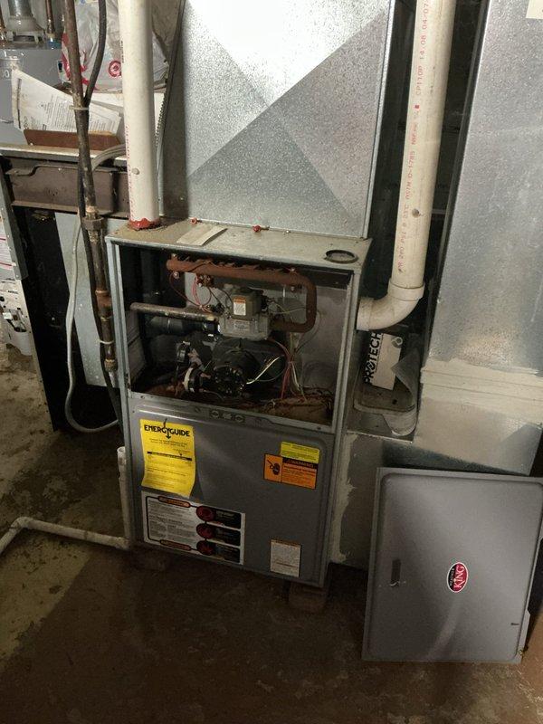 Completed furnace retrofit installation in residential basement utility area. Installed new HVAC furnace system with associated electrical connections, refrigerant lines, condensate drainage piping, and proper venting. Verified electrical panel circuit compatibility and ensured all safety labels and manufacturer specifications were properly displayed on equipment.