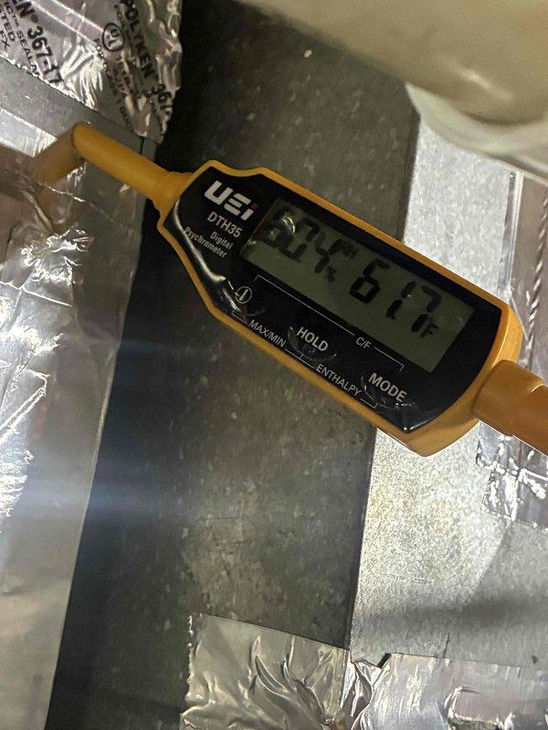 Responded to commercial no cool call for follow-up service. Upon arrival, observed heavy frost accumulation on refrigerant suction line indicating potential low refrigerant charge or restricted airflow issue. Measured supply air temperature at 74.6°F, confirming inadequate cooling performance. System requires further diagnostic work to determine root cause of cooling failure and resolve refrigerant line icing condition.