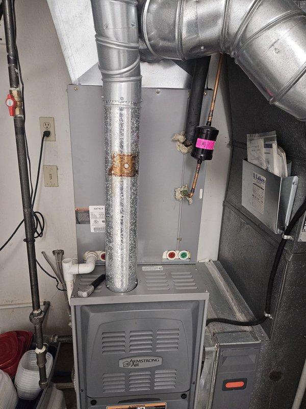 Performed follow-up inspection on residential air conditioning system to verify refrigerant pressures following previous service call. System was recharged with refrigerant and stop leak additive was introduced to address minor leak in the refrigeration circuit. Pressures were rechecked and confirmed to be within manufacturer specifications for proper system operation.