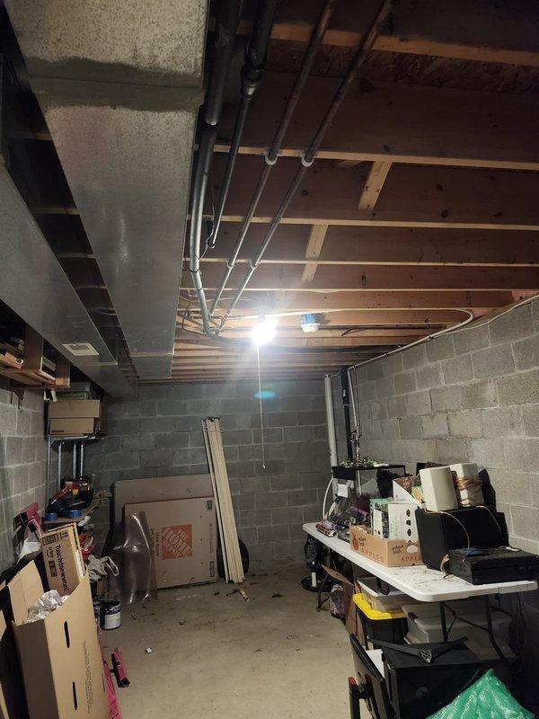 Completed full HVAC system retrofit including furnace and air conditioning equipment. Installed new outdoor condensing unit on existing concrete pad with proper refrigerant line connections and electrical conduit routed through exterior wall. Verified all connections secure and system operational. Equipment positioned against structure with adequate clearance for airflow and future service access.