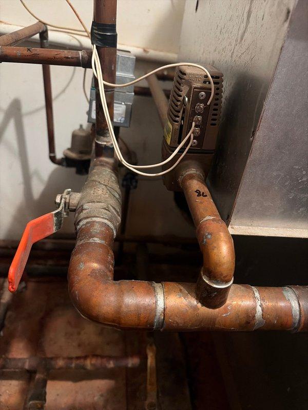 Completed boiler replacement at residential property. Removed existing boiler system and installed new unit with associated copper piping, valves, and control assemblies. Configured piping runs to integrate with existing heating distribution system, including proper soldering of copper joints and installation of isolation valves. Mounted control unit to wall with electrical connections and verified all components functioning properly. System tested and operational upon completion.