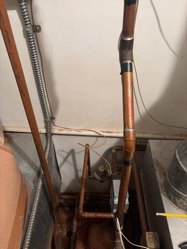 Completed boiler replacement at residential property. Removed existing boiler system and installed new unit with associated copper piping, valves, and control assemblies. Configured piping runs to integrate with existing heating distribution system, including proper soldering of copper joints and installation of isolation valves. Mounted control unit to wall with electrical connections and verified all components functioning properly. System tested and operational upon completion.