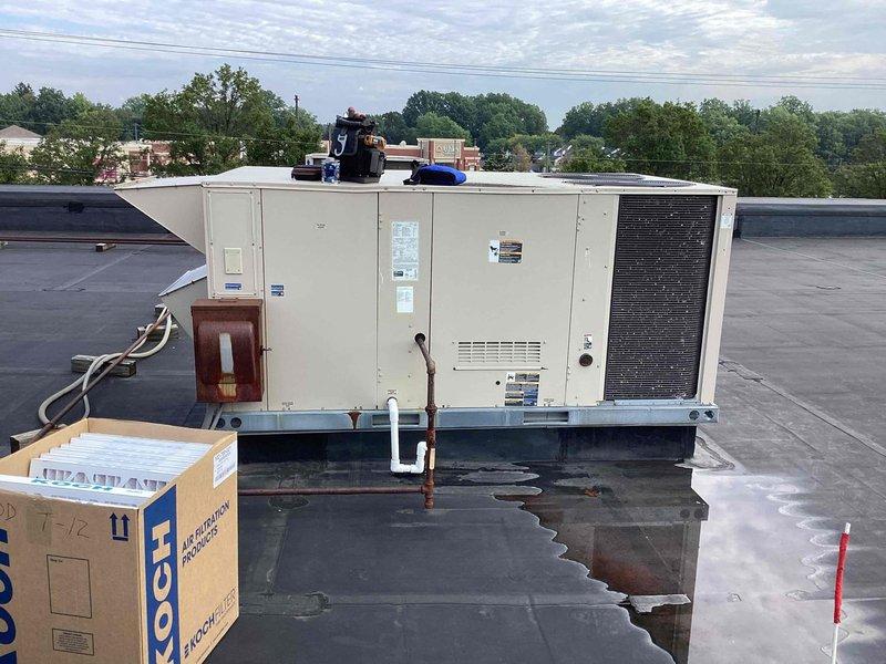 Performed scheduled commercial heating maintenance on rooftop packaged HVAC unit. Conducted comprehensive inspection of refrigerant lines, electrical connections, and evaporator coil assembly, documenting equipment condition with interior and exterior photography. Unit operational with minor dust accumulation noted in air handler compartment.