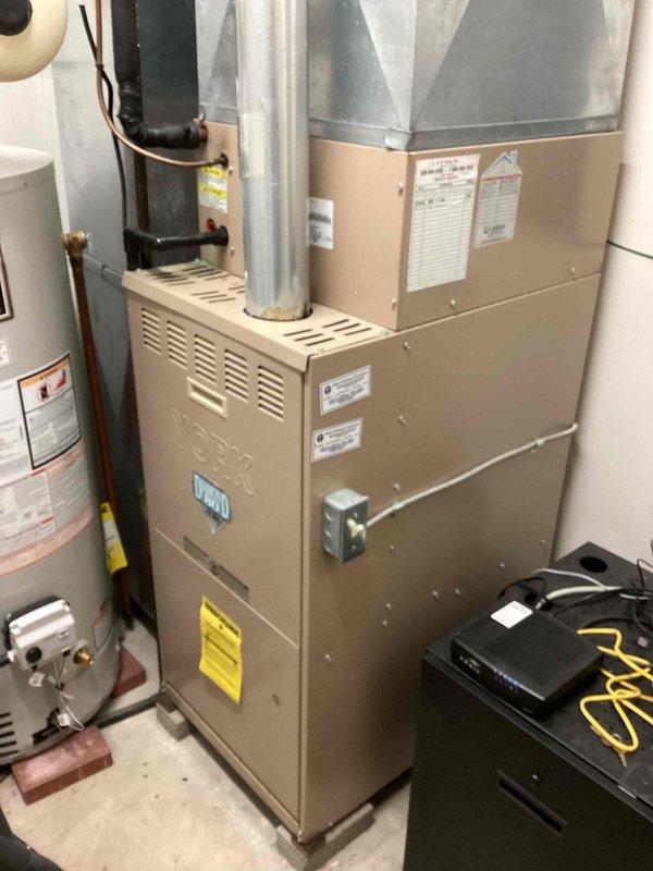 Completed recurring commercial heating maintenance visit on residential HVAC system. Performed comprehensive inspection of furnace unit, verified proper operation of all components, and examined air filter condition. Filter showed moderate dirt accumulation and discoloration from use but remained serviceable. Inspected ductwork connections, water heater integration, and associated mechanical systems to ensure all equipment operating within normal parameters.