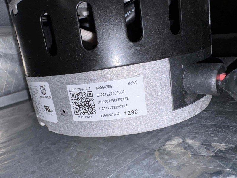 Responded to EH error code displaying on Breeze33 thermostat for new pharmacy HVAC unit. Inspected blower motor assembly (Model ZKFD-750-10-4, Serial A0000765) and verified proper installation and operation. Cleared fault code, confirmed system returned to normal operation with thermostat displaying correctly.