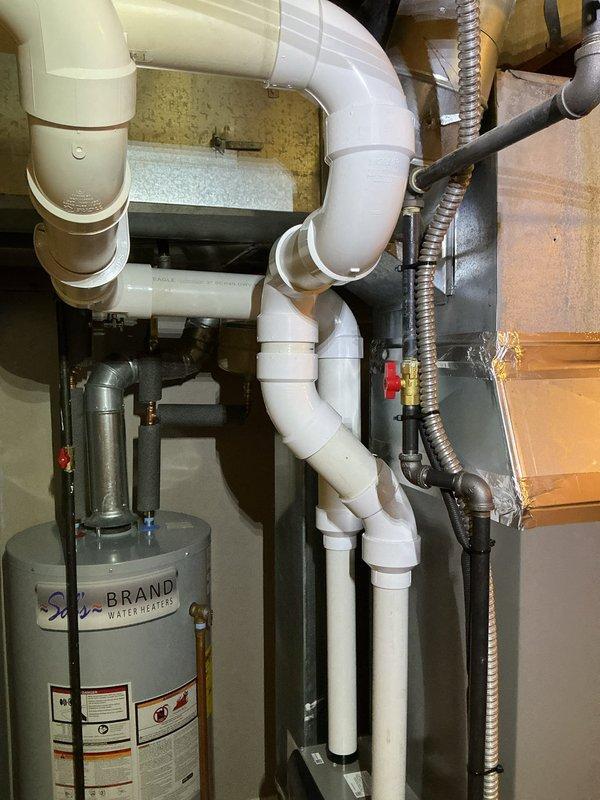 # HVAC Install - Complete System

Completed full HVAC system installation including outdoor condensing unit, indoor air handler, and air quality components. Installed Honeywell S200 system with Honeywell F100 media air cleaner for enhanced filtration and Aprilaire 600 whole-home humidifier for optimal indoor humidity control.

Positioned outdoor AC unit on equipment pad against exterior wall with proper clearance for airflow and serviceability. Established refrigerant line connections between outdoor condensing unit and indoor air handler. Routed all refrigerant piping, electrical wiring, and condensate drainage to code specifications.

Integrated Honeywell F100 air cleaner into return air system to provide superior particulate filtration. Installed Aprilaire 600 humidifier with connection to home water supply using PVC piping and proper drainage provisions. Configured humidifier controls for automatic operation based on indoor humidity levels.

Completed all electrical connections for
