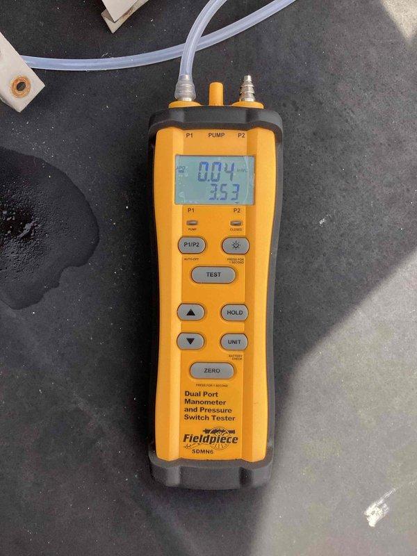 Completed scheduled commercial heating maintenance visit on rooftop unit. Performed comprehensive system inspection revealing significant cabinet deterioration with peeling paint and corrosion on burner assembly and interior surfaces. Conducted operational testing using dual-port manometer to verify gas pressures and system performance, recording readings of 0.04" and 3.59" w.c. Inspected all major components including blower motor, ignition control board, gas valve, and burner manifold. Documented advanced age and weathering of equipment with photographic evidence showing oxidation on metal components and rust formation on burner assembly. System currently operational but exhibiting signs of age-related deterioration that will require monitoring during future service visits.