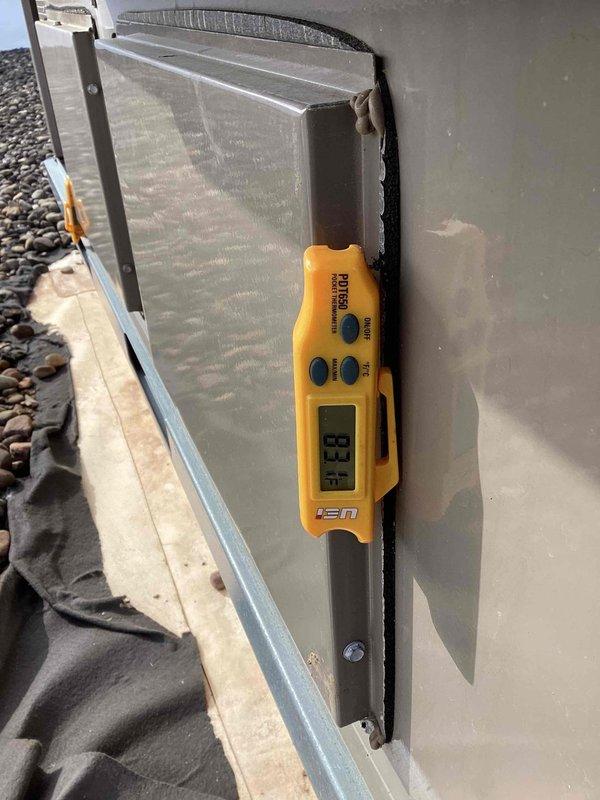 Completed scheduled commercial heating maintenance visit on rooftop HVAC unit. Performed comprehensive system diagnostics using Fieldpiece digital measuring instruments, recording operational readings of 13.8 on diagnostic display. Accessed interior components through service panels to inspect heat exchanger coils, electrical wiring connections, and mounting hardware. All components found to be in functional condition with normal outdoor weathering present. System operating within acceptable parameters.
