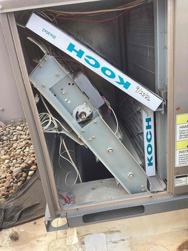 Completed scheduled commercial heating maintenance visit on rooftop HVAC unit. Performed comprehensive system diagnostics using Fieldpiece digital measuring instruments, recording operational readings of 13.8 on diagnostic display. Accessed interior components through service panels to inspect heat exchanger coils, electrical wiring connections, and mounting hardware. All components found to be in functional condition with normal outdoor weathering present. System operating within acceptable parameters.