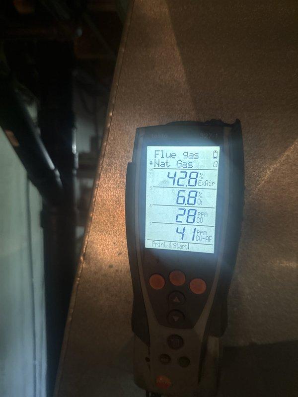 Completed annual furnace tune-up and maintenance inspection on natural gas heating unit located in basement. Performed comprehensive combustion analysis using digital flue gas analyzer, measuring flue temperature at 428°F with CO levels at 4.1 PPM and efficiency at 68%, confirming safe operation within acceptable parameters. Inspected all internal components including burner assembly, gas valve, ignition system, and blower motor. Verified proper electrical connections and control wiring throughout unit. All safety controls tested and functioning properly with no issues identified during inspection.