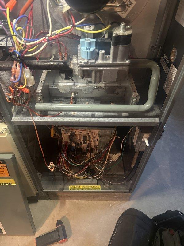 Completed annual furnace tune-up and maintenance inspection on natural gas heating unit located in basement. Performed comprehensive combustion analysis using digital flue gas analyzer, measuring flue temperature at 428°F with CO levels at 4.1 PPM and efficiency at 68%, confirming safe operation within acceptable parameters. Inspected all internal components including burner assembly, gas valve, ignition system, and blower motor. Verified proper electrical connections and control wiring throughout unit. All safety controls tested and functioning properly with no issues identified during inspection.