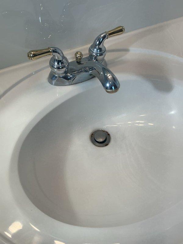 Responded to service call for dripping faucets in bathroom sink and shower. Repaired leaking two-handle centerset faucet at bathroom sink and addressed dripping shower valve. Installed new shower head per customer request to replace existing fixture. All faucets tested and confirmed operating properly without leaks upon completion.