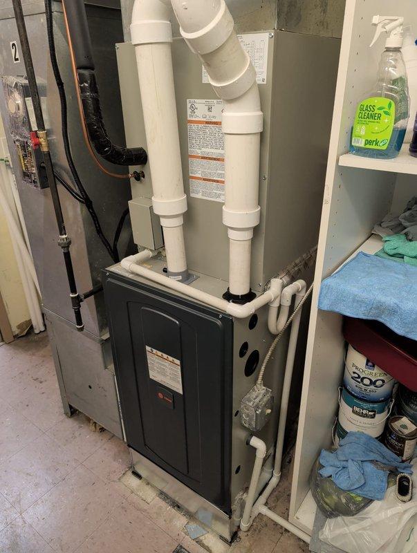 Completed full HVAC system retrofit including furnace and air conditioning equipment. Installed new furnace unit with proper PVC venting configuration, established all electrical connections with dedicated circuit protection, and charged the AC system with R-454B refrigerant to manufacturer specifications. System testing confirmed proper pressures at 184 psig low side and 183 psig high side, with superheat and subcooling readings within acceptable parameters for optimal performance.