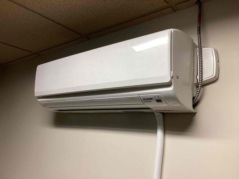 Responded to service call for Mitsubishi mini-split system displaying AE error code. Inspected both outdoor condenser unit located on flat roof and indoor air handler mounted in interior space. Diagnosed error code, performed necessary troubleshooting and system diagnostics, and resolved the fault condition. Verified proper operation of both indoor and outdoor units upon completion, with system returning to normal functionality.