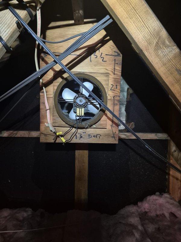 Completed installation of attic exhaust ventilation system including mounting of circular exhaust fan units within wooden framework between roof joists. Established proper electrical connections with junction boxes, verified motor operation, and ensured adequate airflow capacity for attic space ventilation in accordance with new construction specifications.