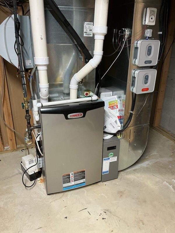 Completed replacement of two residential furnaces at the property—one serving the main house and one serving the garage. Removed existing units and installed new Lennox furnace systems with proper venting, gas line connections, electrical wiring, and ductwork integration. All installations include new PVC venting routed vertically, properly connected gas valves, blower motor assemblies, and control wiring. Wall-mounted thermostats installed and wired for each zone. All systems tested for proper operation, safety controls verified, and installations brought to code compliance.
