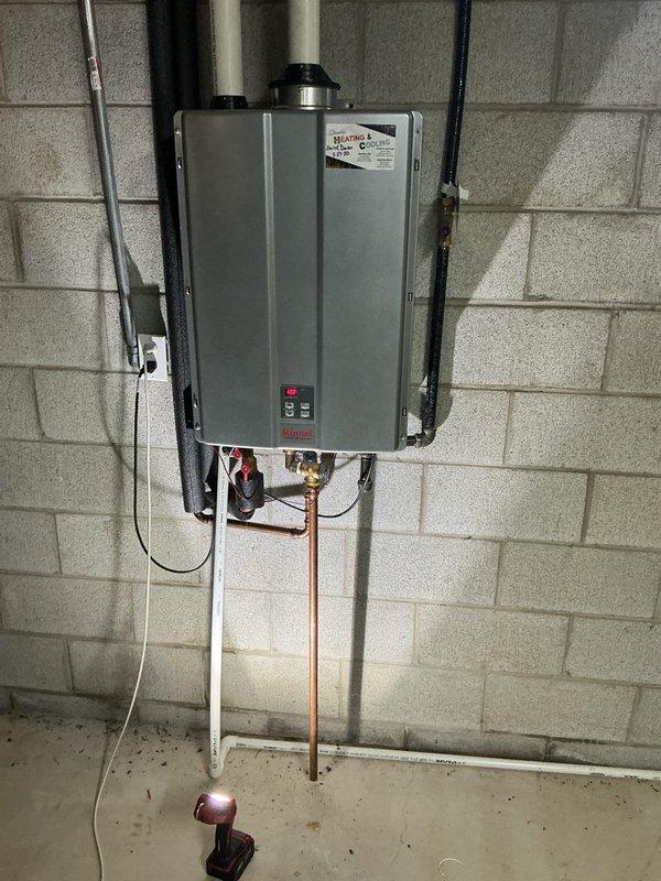 Performed comprehensive descaling maintenance on wall-mounted tankless water heater system. Flushed unit using descaling solution to remove mineral buildup from heat exchanger, ensuring optimal performance and efficiency. Verified all plumbing connections, gas lines, and venting system were secure and functioning properly upon completion.