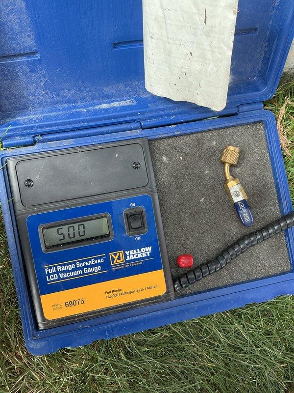 Replaced failed compressor on commercial walk-in cooler unit. System was evacuated using digital vacuum gauge to achieve proper 500-micron vacuum level, then recharged with appropriate refrigerant using manifold gauge set to verify correct operating pressures across both high and low sides.