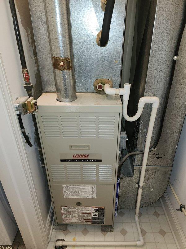 Completed full HVAC system retrofit including installation of new Lennox furnace in basement utility room and outdoor condensing unit. Installed all necessary ductwork connections with galvanized steel components, configured PVC condensate drainage system with proper trap, and ran refrigerant lines with insulation from outdoor unit to indoor coil. Mounted electrical disconnect box on exterior wall, established all electrical connections, and positioned outdoor unit on concrete pad with proper clearances. System tested and operational.
