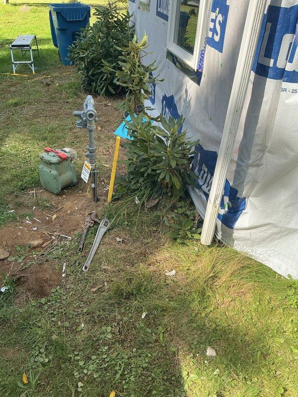 Conducted site assessment for gas line relocation project at residential property. Evaluated existing gas piping configuration in basement utility area and exterior yard location to determine materials and fittings required for the move. Documented current pipe routing, measured distances, and identified connection points including existing PVC vent piping and utility infrastructure to create comprehensive material list for upcoming gas line installation work.