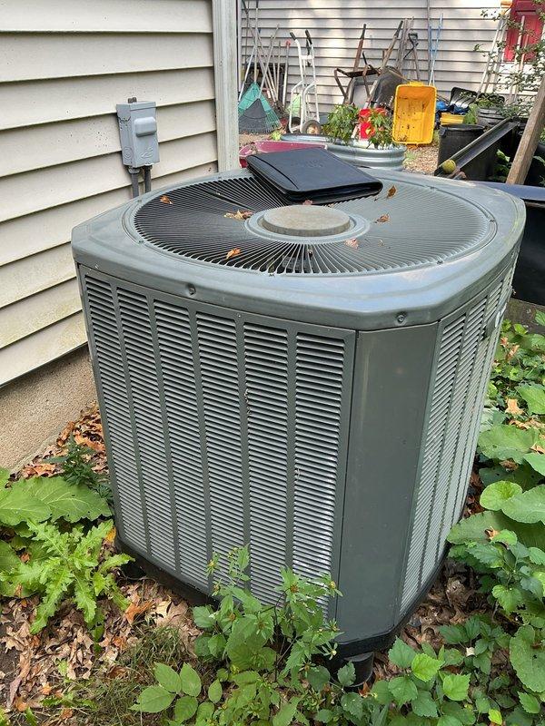 Completed full HVAC system replacement including furnace and outdoor air conditioning condenser unit. Removed existing equipment and installed new furnace with internal components, blower assembly, and updated circuit boards, along with proper PVC venting and condensate drainage piping. Replaced outdoor condenser unit positioned against exterior wall, ensuring proper electrical connections to existing meter box and adequate clearance from surrounding landscaping and mulch bed.