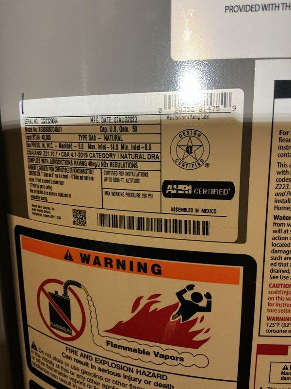 Performed estimate and inspection of 50-gallon natural gas water heater manufactured in July 2020. Unit is installed in basement utility area with proper clearances and venting. Documented existing installation including copper supply lines with insulation, pressure relief valve piping, and gas connections. Water heater appears to be functioning with all required safety labels and certifications intact. Provided customer with assessment and recommendations for service options.