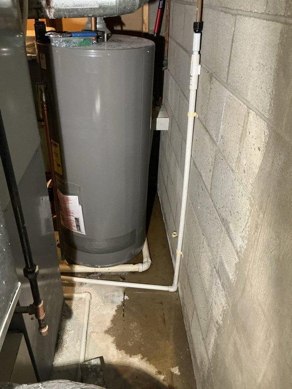 Performed estimate and inspection of 50-gallon natural gas water heater manufactured in July 2020. Unit is installed in basement utility area with proper clearances and venting. Documented existing installation including copper supply lines with insulation, pressure relief valve piping, and gas connections. Water heater appears to be functioning with all required safety labels and certifications intact. Provided customer with assessment and recommendations for service options.