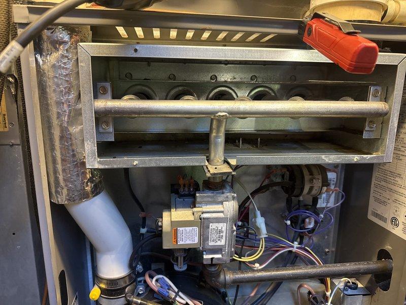 Completed fall maintenance tune-up on 15-20 year old gas furnace located in basement as part of annual preventative maintenance package. Performed comprehensive inspection of all system components including burner assembly, heat exchanger, gas valves, ignition system, and blower motor. Conducted combustion analysis using Testo 327-1 analyzer, which confirmed safe operating parameters with oxygen levels at 6.9%, carbon monoxide at 2 ppm, and carbon monoxide air-free at 3 ppm. Verified proper gas combustion efficiency and flue gas temperatures within manufacturer specifications. Inspected burner flames for proper ignition and uniform flame pattern across all burners. Checked all electrical connections, control wiring, and safety switches for secure operation. Examined PVC venting system for proper drainage and clearances. Tested thermostat operation and system cycling. All components found to be functioning properly with no immediate repairs needed at this time. System is operating safel