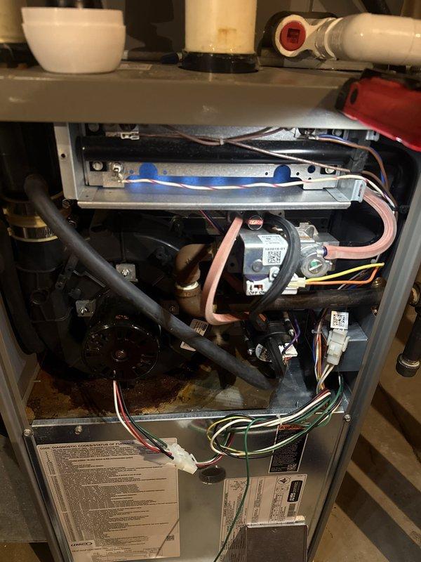 Completed annual heating maintenance and tune-up on residential gas furnace. Performed comprehensive system inspection with access panel removed, checked all electrical connections and wiring, verified proper operation of blower motor assembly, inspected condensate drain pan and drainage system for proper function. Conducted combustion analysis using digital analyzer, measuring flue gas temperatures and natural gas combustion efficiency to ensure optimal performance and safe operation. All components found operating within manufacturer specifications, system cleaned and tested successfully.