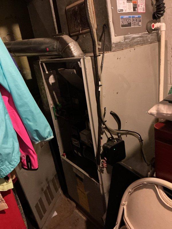 Completed furnace retrofit installation in residential basement mechanical room. Replaced existing heating unit with new furnace system, including integration of blower motor assembly, heat exchanger, and electronic control board with updated wiring connections. Installed new copper refrigerant lines and verified proper connection to existing ductwork system. All electrical connections completed to code with appropriate disconnect switch and safety labeling applied to unit exterior and interior compartments.