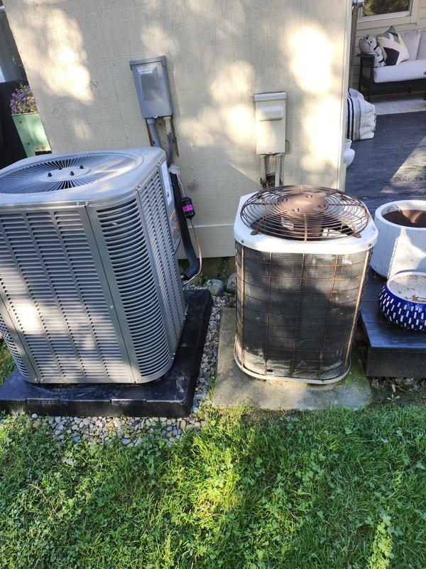 Completed full HVAC system installation featuring an 80% efficiency downflow furnace with new refrigerant lineset. Installed dual outdoor condensing units on concrete pads with proper electrical disconnects and positioned new indoor air handling equipment in utility area with appropriate drainage and ventilation connections.