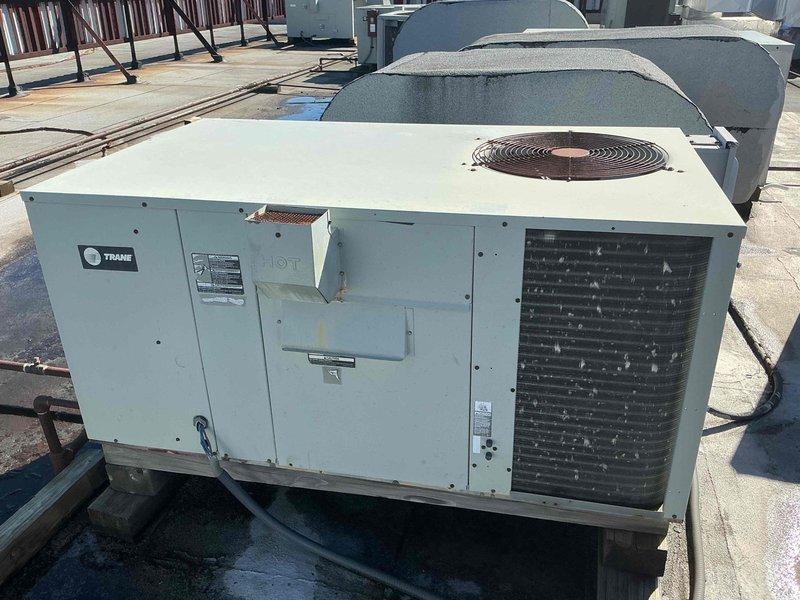 # HVAC Service Report

Responded to service call for non-operational Trane rooftop unit G on commercial building. Upon arrival, conducted visual inspection of the packaged rooftop unit and accessed internal components to diagnose the failure. Investigation revealed issues with the gas valve assembly requiring attention. Inspected gas valve connections, wiring harness including orange, blue, red, and purple control wires, and associated gas piping. Verified proper wire terminations at gas valve and checked for secure mounting of all components. Examined condition of filter drier and associated refrigerant lines. Restored unit to operational status and verified proper system function before departure.