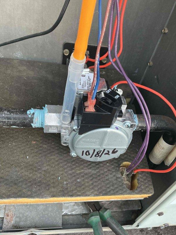 # HVAC Service Report

Responded to service call for non-operational Trane rooftop unit G on commercial building. Upon arrival, conducted visual inspection of the packaged rooftop unit and accessed internal components to diagnose the failure. Investigation revealed issues with the gas valve assembly requiring attention. Inspected gas valve connections, wiring harness including orange, blue, red, and purple control wires, and associated gas piping. Verified proper wire terminations at gas valve and checked for secure mounting of all components. Examined condition of filter drier and associated refrigerant lines. Restored unit to operational status and verified proper system function before departure.