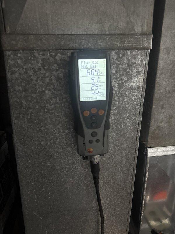 Performed comprehensive heating system maintenance including cleaning and inspection of furnace components. Replaced air filter with new pleated media filter and conducted combustion analysis of natural gas furnace, recording flue gas temperature of 684°F with CO levels at 9 ppm and oxygen content at 25%, confirming proper burner operation and safe venting. System operating within manufacturer specifications with no issues identified.