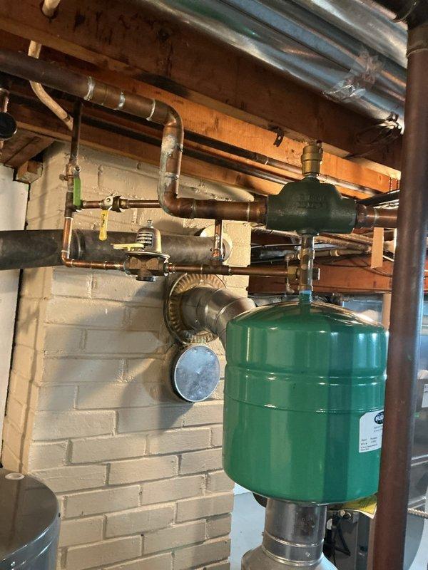 Completed furnace cleaning and inspection service. Verified proper operation of heating system, inspected copper piping connections and expansion tank assembly, and confirmed all mechanical components are functioning within normal parameters.