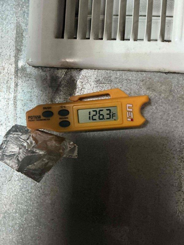 Performed a scheduled commercial heating maintenance visit, inspecting the return air ductwork and verifying the 16x25x1 filter installation, which was found to be dated 10/19/21 and in need of replacement. Measured duct surface temperature at 126.3°F with a digital pocket thermometer to confirm heating operation, and checked the foil-taped duct seams, with no damage, frost, or rust observed.