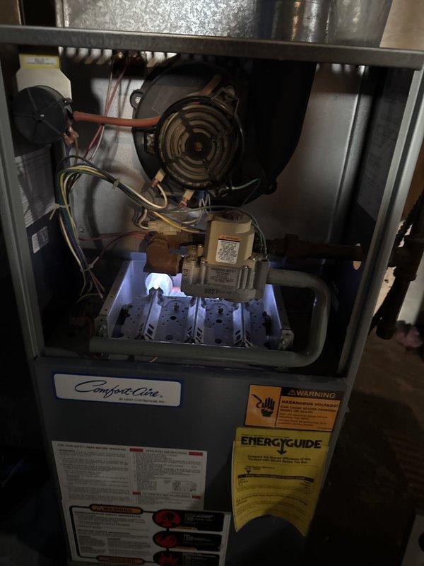 Responded to a no-heat call on a Comfort-Aire gas furnace reported to have a buzzing noise and failure to cycle, with a suspected blower motor or control board fault. Inspected the inducer assembly, pressure switch, gas valve, and burner compartment, then restored operation with stable burner flame established. Verified performance with a combustion analysis on natural gas, recording 5.6% O2, 32.5% excess air, 27 ppm CO, and 37 ppm air-free CO, all within acceptable limits.