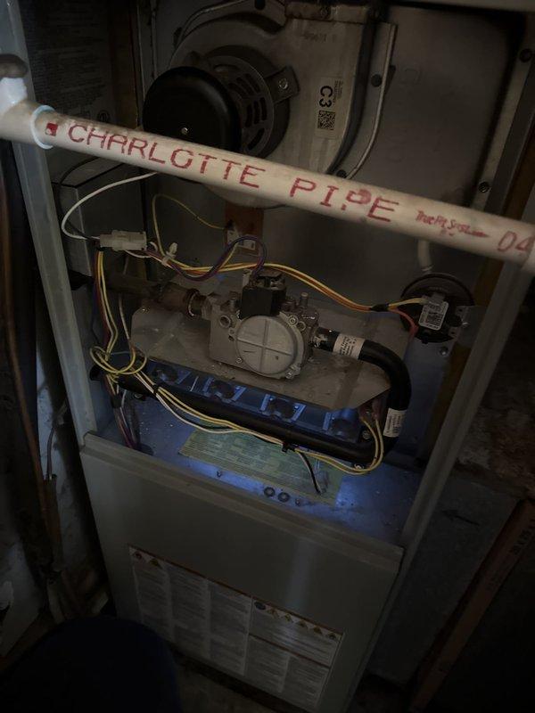 Performed annual heating maintenance on a gas furnace, inspecting the gas valve, pressure switch, inducer assembly, venting, and wiring with the access panel removed; no visible rust, breakage, or damage was found. Conducted a flue gas combustion analysis on natural gas, recording 9.2% O2, 69.7% excess air, 3 ppm CO, and 5 ppm air-free CO, confirming safe, complete combustion within normal operating parameters.