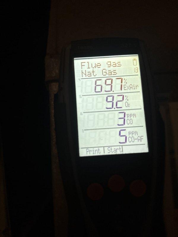 Performed annual heating maintenance on a gas furnace, inspecting the gas valve, pressure switch, inducer assembly, venting, and wiring with the access panel removed; no visible rust, breakage, or damage was found. Conducted a flue gas combustion analysis on natural gas, recording 9.2% O2, 69.7% excess air, 3 ppm CO, and 5 ppm air-free CO, confirming safe, complete combustion within normal operating parameters.