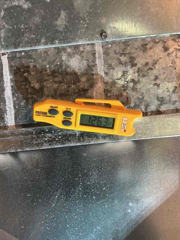 Performed scheduled contract maintenance on a Payne gas-fired furnace serving the commercial space, including visual inspection of the cabinet, plenum, ductwork, flue venting, gas piping, and electrical connections. Verified heating operation by measuring supply-air temperature at the plenum with a digital thermometer, recording 126.3°F, within normal range for gas heat. No frost, ice, rust, or component damage was observed, and the unit was left operating normally.